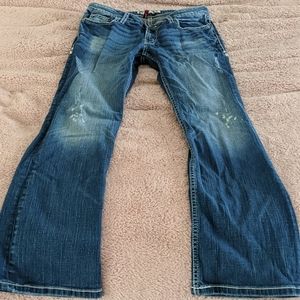 Buckle low rise boot cut jeans